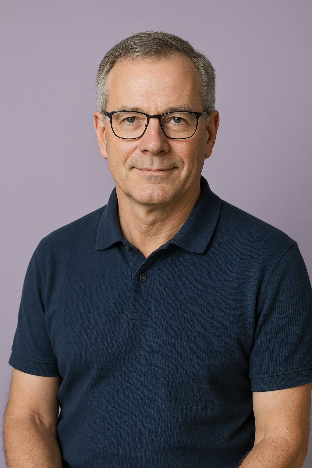 Business professional portrait with glasses and blue polo